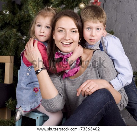 portrait of happy family near Christmas tree