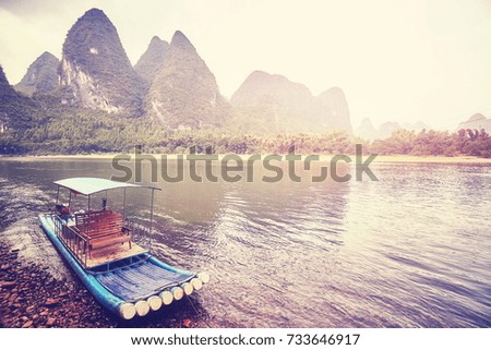 Vintage stylized picture of a bamboo raft at Li River, Xingping, China.