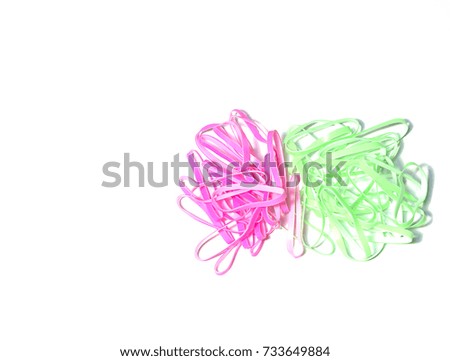 Green and Pink Rubber band on white background