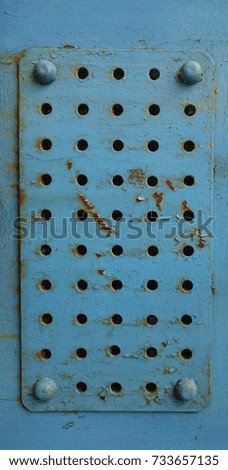 metal texture for background.  blue regular iron background. blue painting metal with many rusty holes. 