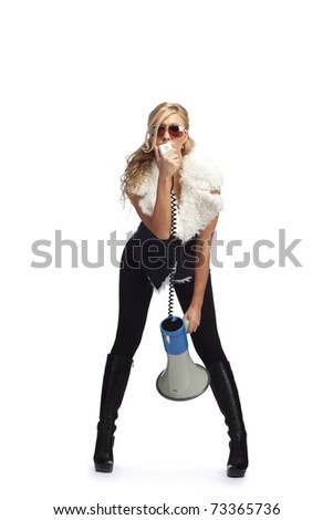 Young fashionable woman with megaphone