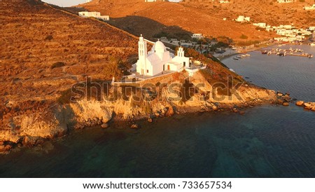 Aerial birds eye view photo taken by drone of famous church of Agia Eirini in port of Ios island at sunset, Cyclades, Greece