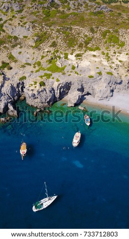 Summer 2017: Aerial birds eye view photo taken by drone of rocky tropical beach with turquoise clear waters