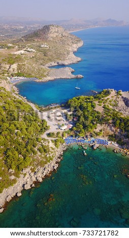 Summer 2017: Aerial bird's eye view photo taken by drone of famous beach of Anthony Quinn with clear water rocky seascape, Rhodes island, Greece