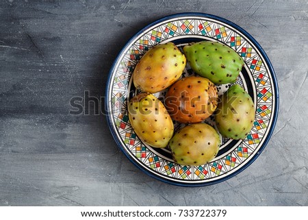 Opuntia ficus-indica, Barbary fig, cactus pear, spineless cactus, prickly pear, Indian fig opuntia on a plate for dessert Royalty-Free Stock Photo #733722379