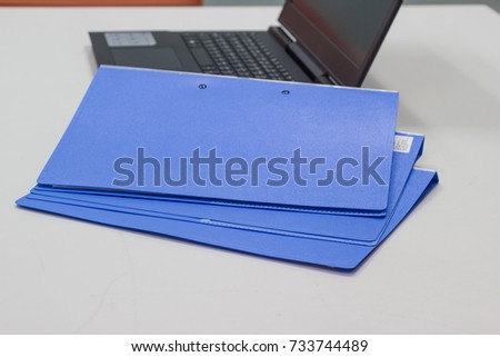 File folder with Documents and Notebook background on white table in meeting room - concept business