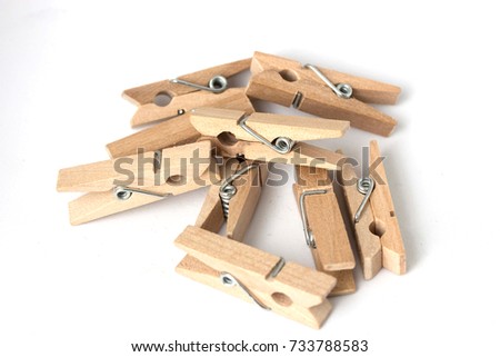 Wood clothespins isolated on white background