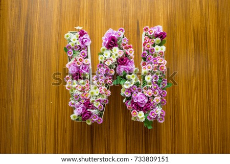 Wooden toilet door with flower W sign for female, woman toilet, restroom