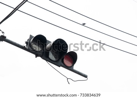 Red traffic light with electric wire background
