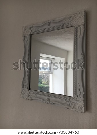 White mirror on bedroom wall