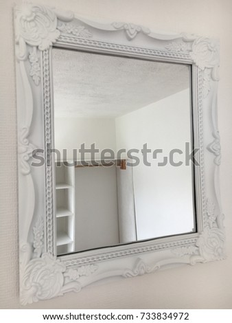 White mirror on bedroom wall