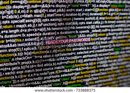 Macro photo of computer screen with program source code and highlighted HIJACK YOUR PASSWORDS inscription in the middle. Script on the screen with virus in it. Cyber security concept. Technology