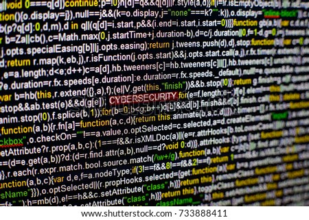 Macro photo of computer screen with program source code and highlighted CYBERSECURITY inscription in the middle. Script on the screen with virus in it. Cyber security concept. Technology background.