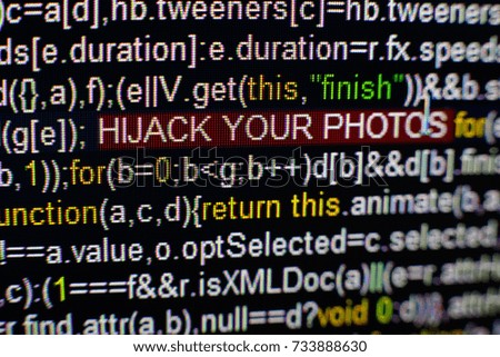 Macro photo of computer screen with program source code and highlighted HIJACK YOUR PHOTOS inscription in the middle. Script on the screen with virus in it. Cyber security concept. Technology