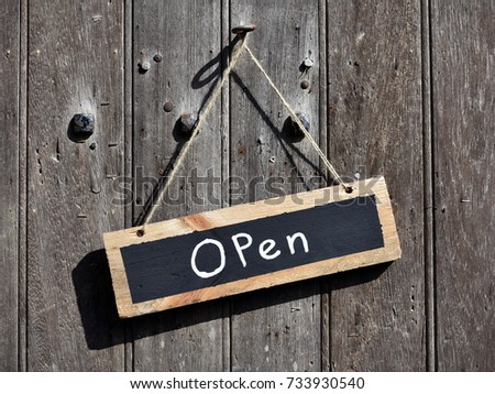 Open Sign Hanging on a Shop Door