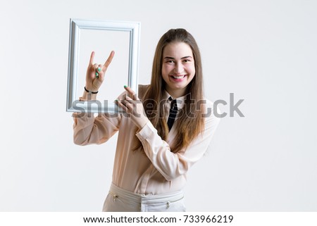 Girl with frame of picture in hand