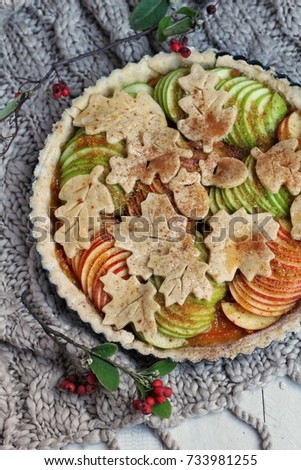 Seasonal home made  apple pie with tangerine marmalade for autumn celebration, overhead shot.