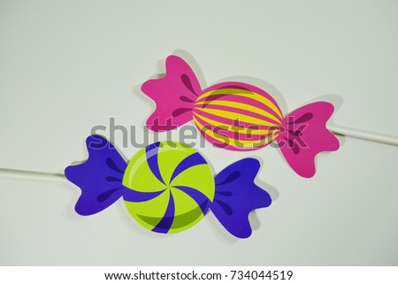 Top or flat lay view of Photo booth props a colorful candy on isolated white background flat lay. Birthday parties and weddings.