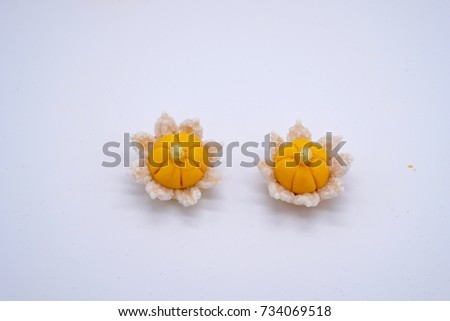 Traditional Thai sweet dessert mainly made by egg yolks , sugar on top with gold leaf .this picture on white background