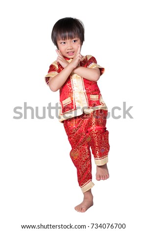 Concept Happy Chinese new year. Happy asian boy in traditional chinese ancient dress and raising hands in isolated on white background. Little kid in Ancient Chinese red Costumes. Clipping path