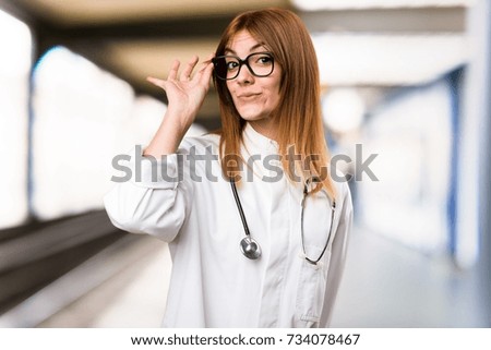 Young doctor woman with glasses in the hospital