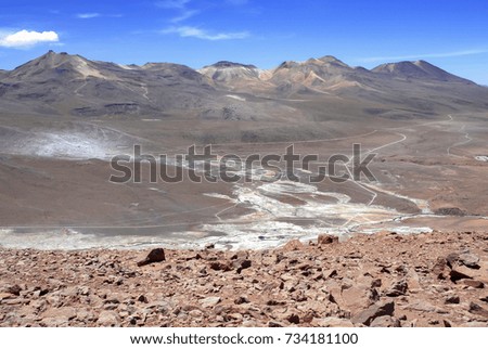 Spartan volcanic landscape of the Atacama Desert, an arid and remote high plateau of rock, mountains and sand in Chile near the Bolivia border, South America