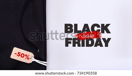 tag with the inscription black Friday on the background of a black bag with a string