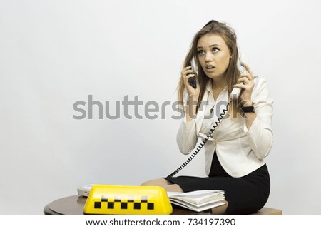 Taxi Advertising Company. The taxi dispatcher - reception of orders, waiting for the car, telephone conversations

