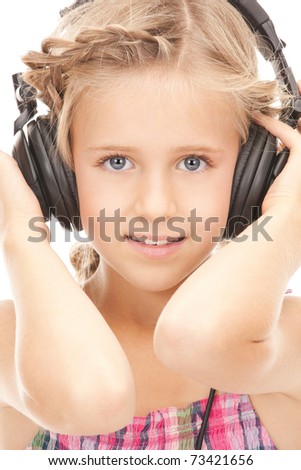picture of happy girl in big headphones