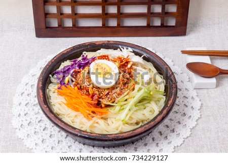  Spicy Cold Chewy Noodles - jjolmyeon  Royalty-Free Stock Photo #734229127