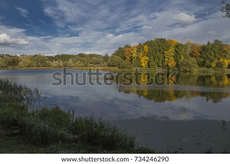 autumn reflections in the water, colorful nature   Royalty-Free Stock Photo #734246290