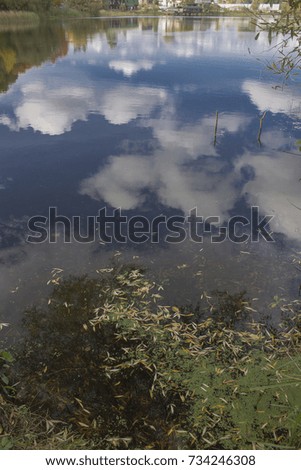 autumn reflections in the water, colorful nature   Royalty-Free Stock Photo #734246308