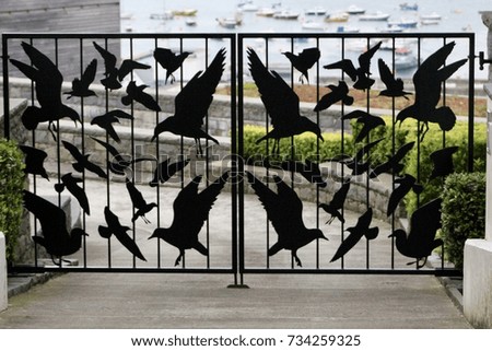 fence with a picture of crows