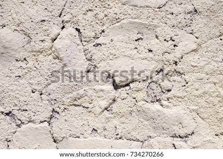 detail of beige rough wall, closeup, Santorini Greece

