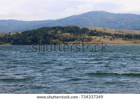 Autumnal landscape in Bulgarian countryside with a lake