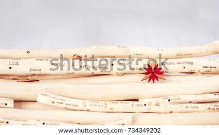 background of christmas greeting inscription burned on driftwood