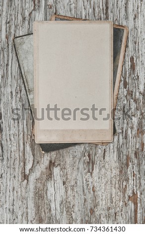 Vintage background with old photos on wood texture