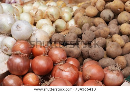 onions and potatoes in the market