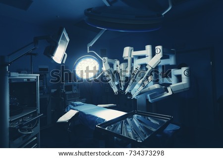 Surgical room in hospital with robotic technology equipment, machine arm surgeon in futuristic operation room. Minimal invasive surgical inoovation, medical robot surgery with 3D view endoscopy Royalty-Free Stock Photo #734373298