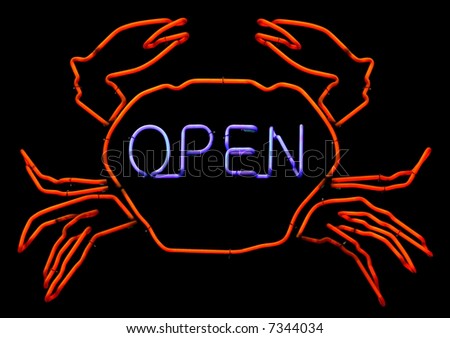 Neon sign of a Crab with the word Open.