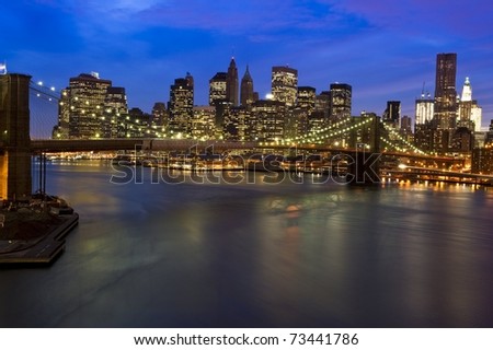 Striking photograph of downtown Manhattan Skyline and Brooklyn Bridge across the East River