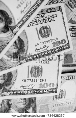 Many banknotes in face value of $ 100 on the front and back. Income, investment, successful business. Background close-up of US dollars / background texture of US dollars. Black and white photo