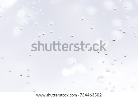 a lot of bubbles on white abstract bokeh background Royalty-Free Stock Photo #734463502