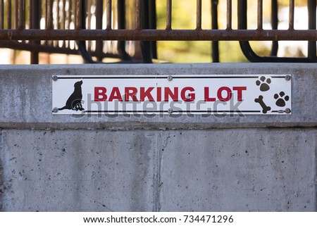 Funny sign "Barking Lot" the place where dogs will be tied.