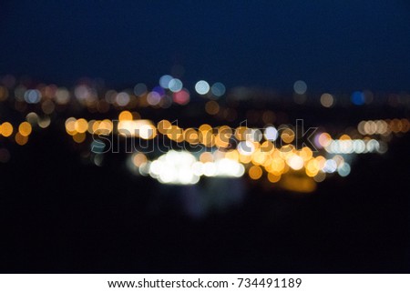Blured city lights in warm orange and white colors of munich in bavaria unfocused