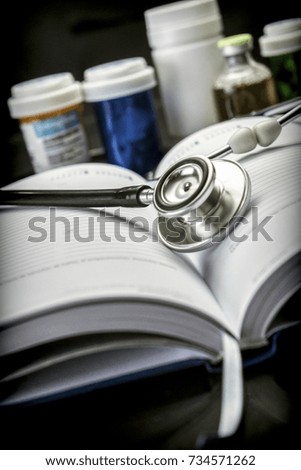 Stethoscope on a medicine book, conceptual image
