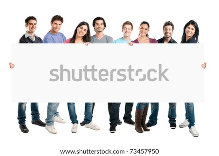 Happy smiling group of friends standing together in a row and displaying a white placard to write it on your own text, isolated on white background