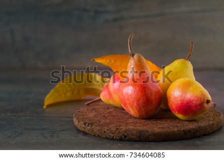Fresh ripe organic autumn pears on rustic wooden table