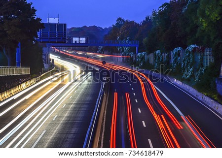 Car light trails on the highway.