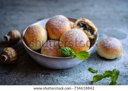 Fresh homemade buns filled with poppy seeds and grated apple